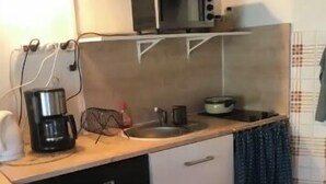 A compact kitchen with a microwave, coffee maker, and sink. - Studio with garden (Enchastrayes)