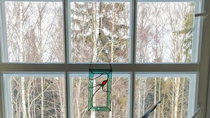 A room with a large window, a potted plant, and two chairs. - Wiisalan Kartano (Rantasalmi)