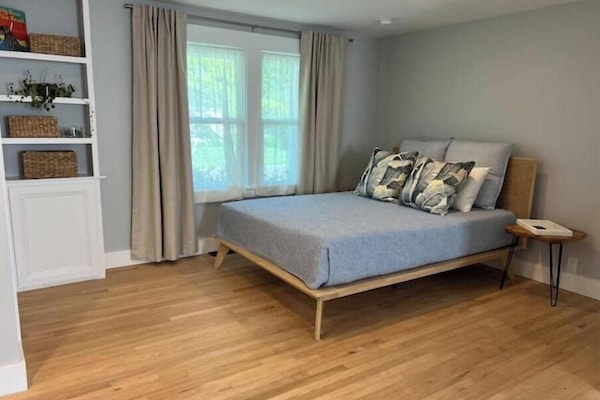 Comfortable new queen mattress. All windows have room darkening drapes.