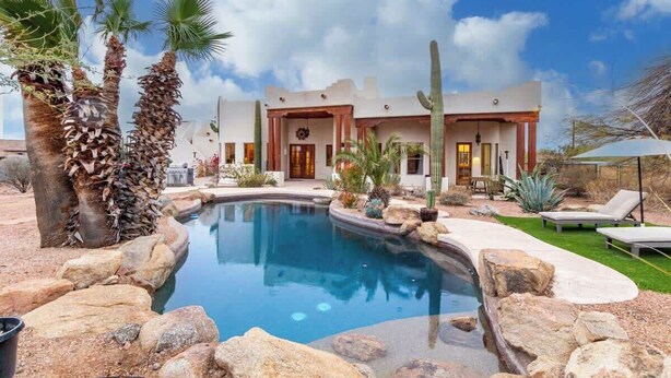 A pool with a house in the background. - Relaxing 3BR Haven w/ Pool & BBQ for Family Time (Mesa)