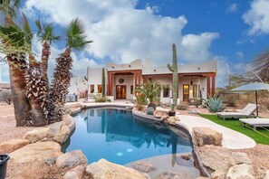 A pool with a house in the background. - Relaxing 3BR Haven w/ Pool & BBQ for Family Time (Mesa)