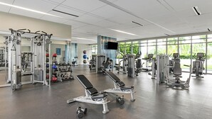 A gym with various exercise equipment, including weight machines, benches, and dumbbells. - Marriott's Crystal Shores - Marco Island, FL - 2 BR Gulf Side (Marco Island)