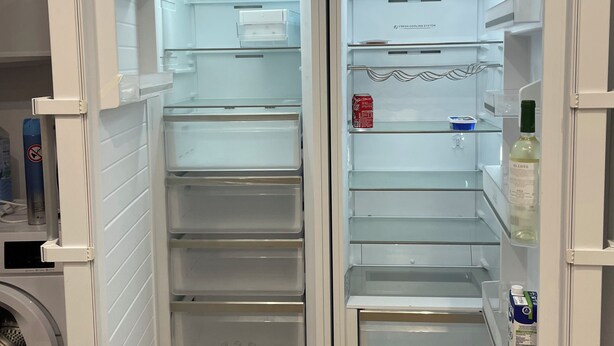 A modern, white refrigerator with multiple shelves and compartments, including a fresh cooling system label. - Spacious 4-bedroom apartment with WiFi, AC in gorgeous Fuengirola (Fuengirola)