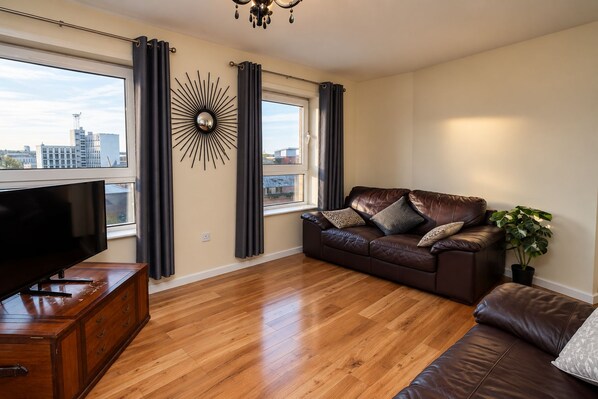 Living Room, Sofa, Seating Area, TV, Streaming Services, City View