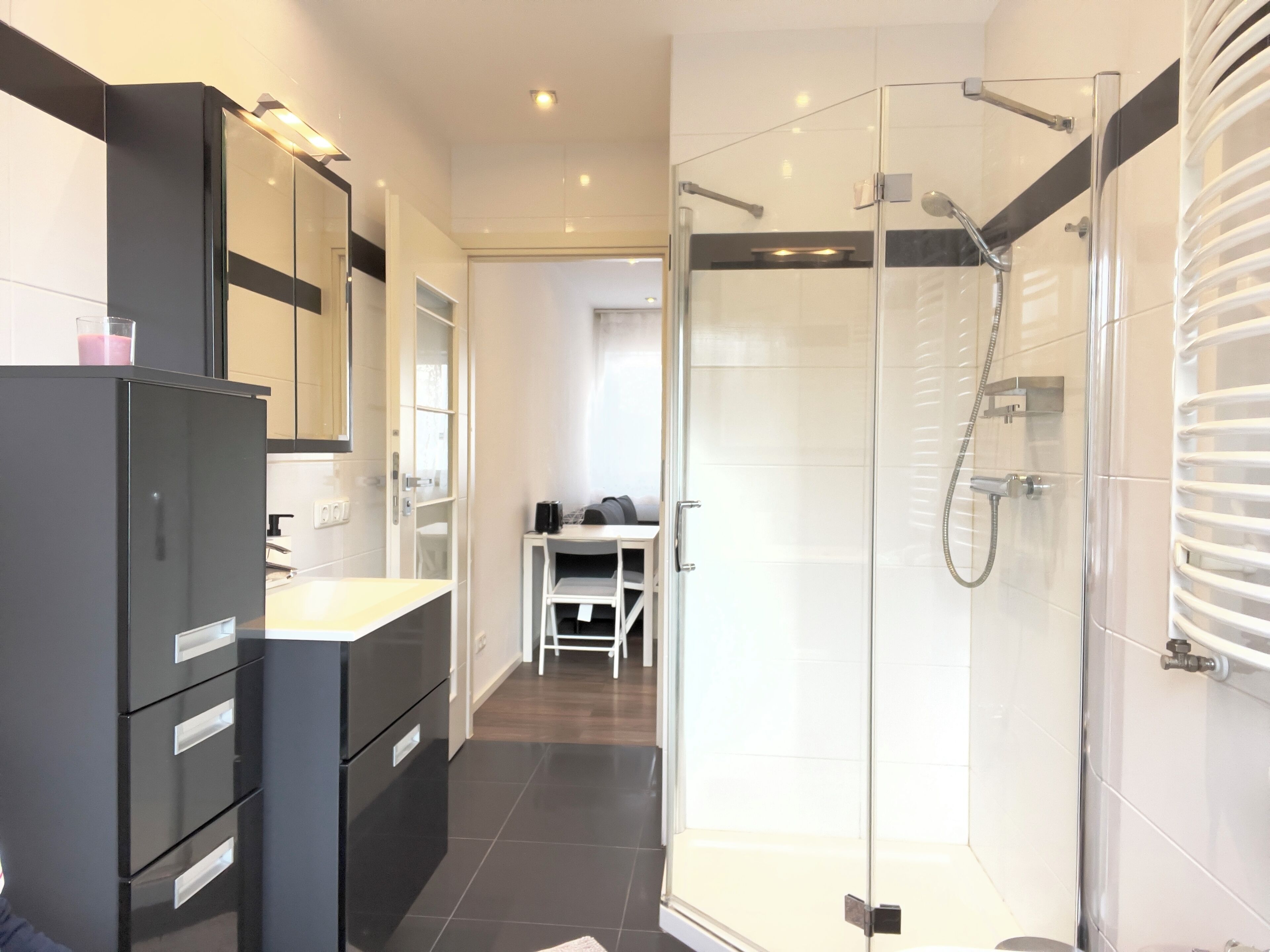 Shower, hair dryer, towels, toilet paper