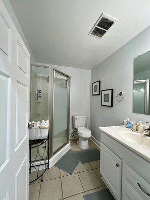 Shower, hair dryer, towels, soap
