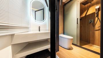 Family Room, Hill View | Bathroom | Shower, hair dryer, bathrobes, slippers