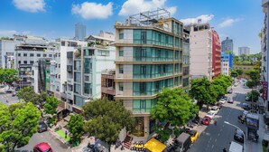 A multi-story hotel with a modern design, featuring large windows and a prominent entrance. - Salute Saigon Hotel and Spa (Ho Chi Minh City)