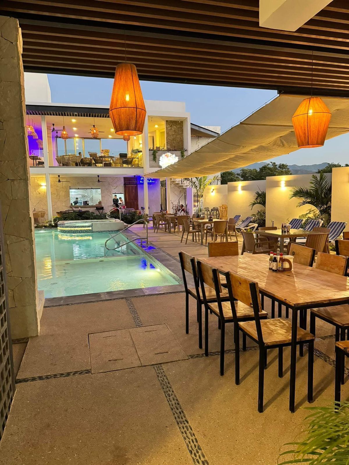 Outdoor pool, open 9:00 AM to 9:00 PM, pool umbrellas