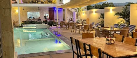 Outdoor pool, open 9:00 AM to 9:00 PM, pool umbrellas