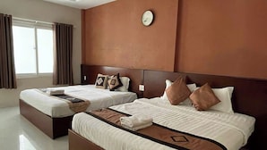 A large, modern hotel room with a large bed, a smaller bed, and a separate seating area. - Volga Hotel & Appartment Mui Ne (Mui Ne)