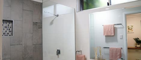 Shower, towels, soap, toilet paper