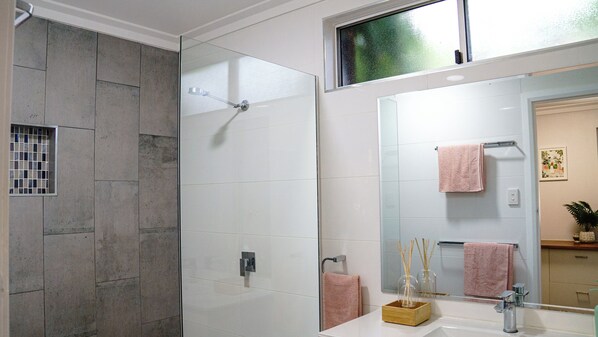Shower, towels, soap, toilet paper