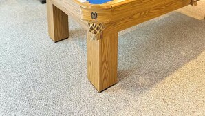 A pool table with balls and cues, a sofa, a television, and a window with curtains. - Waterfront Oasis~Pool Table~Deck~Dock~Garage (Dover)