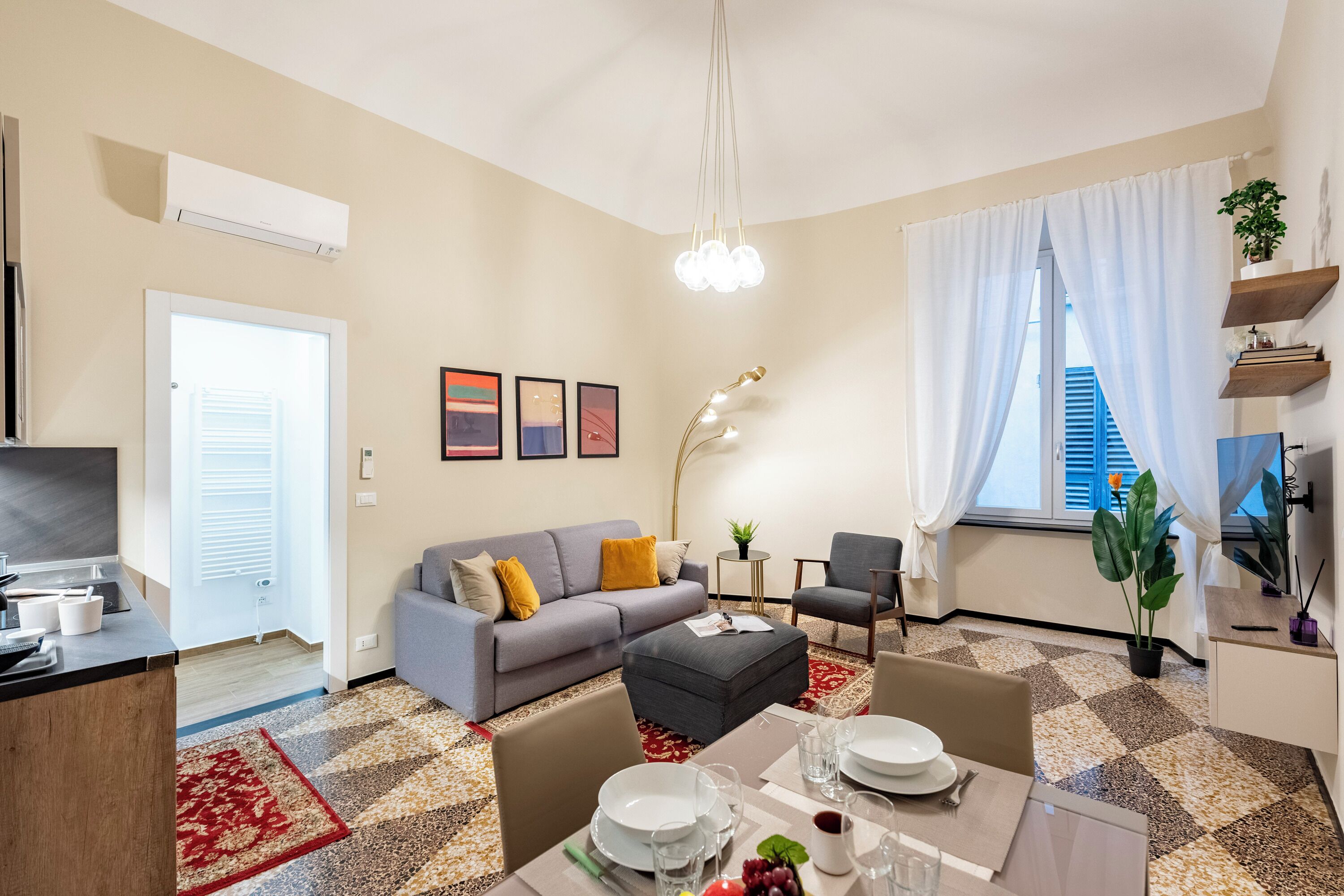 Family Apartment, Multiple Bedrooms (Lovely Flat In Genova Historic Center) | Living area | 21-inch flat-screen TV with digital channels