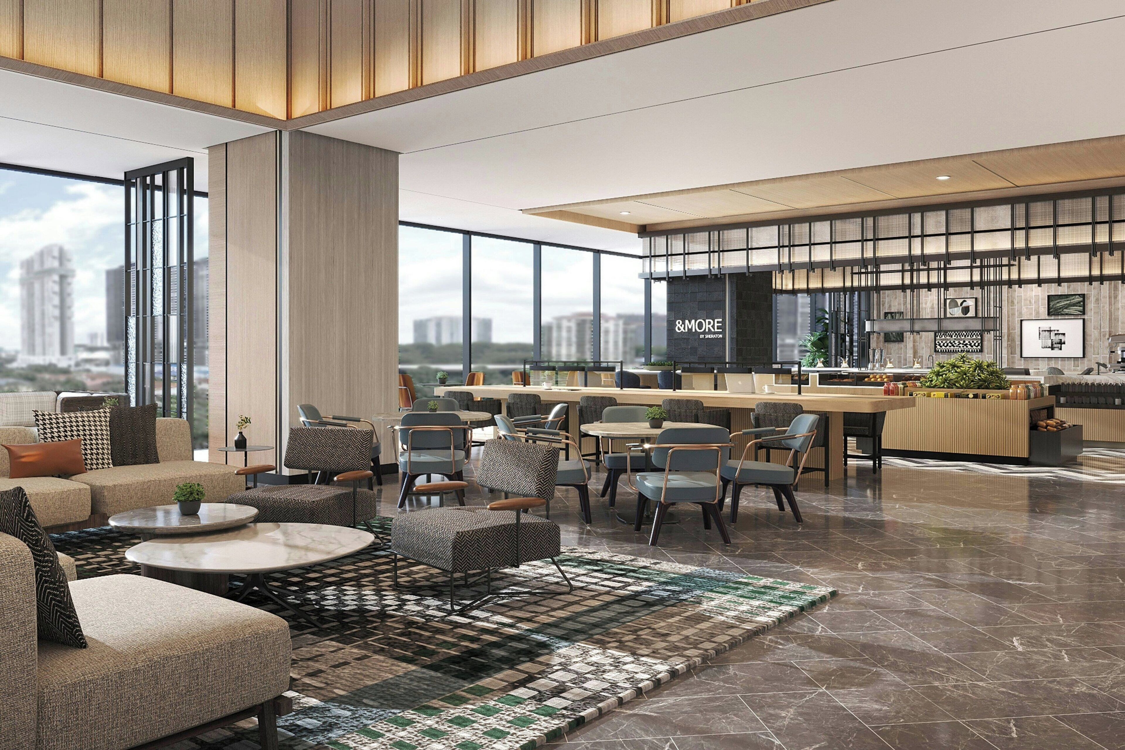 A spacious hotel lobby with a modern design, featuring a seating area with sofas and chairs, a bar area, and large windows offering a city view.