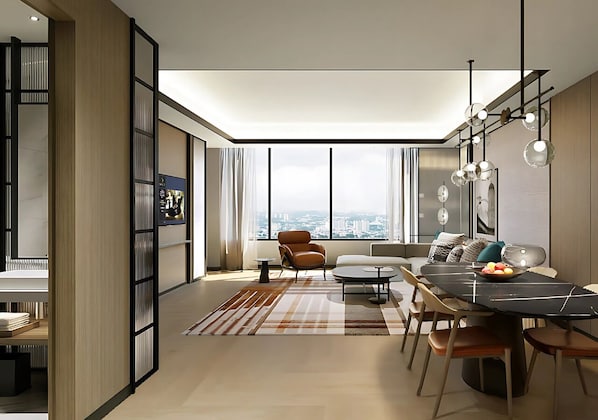 A modern living room with a dining area, large windows, and a city view. - Sheraton Johor Bahru (Johor Bahru)