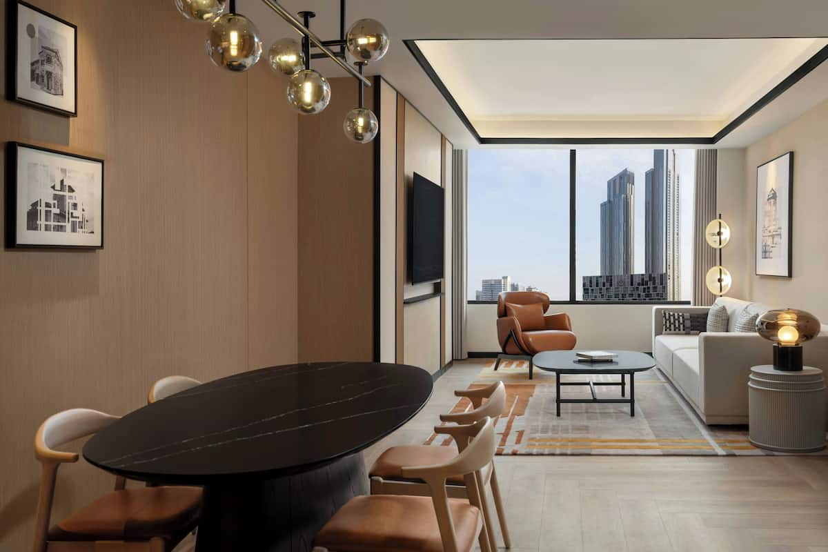 Deluxe Suite, 1 King Bed | Living room | 55-inch LED TV with satellite channels