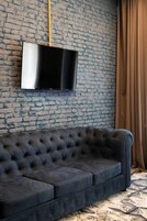 Deluxe Room, 1 King Bed, Non Smoking, City View | Minibar, soundproofing, iron/ironing board, cribs/infant beds