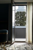 Junior Suite, Balcony, City View | Minibar, soundproofing, iron/ironing board, cribs/infant beds