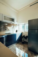 Family Suite, Balcony | Private kitchen | Microwave, electric kettle, cookware/dishes/utensils