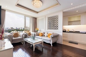 Deluxe Apartment, City View | Living area | 55-inch LED TV with cable channels, Netflix, streaming services - Luxury Condotel Luminous Leman (Ho Chi Minh City)