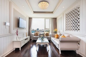 Deluxe Apartment, City View | Living area | 55-inch LED TV with cable channels, Netflix, streaming services - Luxury Condotel Luminous Leman (Ho Chi Minh City)