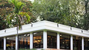 A modern building with large windows and a covered outdoor area. - Club Mahindra Golden Landmark (Mysore)