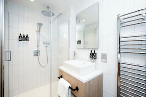Shower, hair dryer, towels, soap