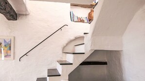 A staircase with white walls and black handrails, leading to a lower level. - Stunning  villa for 4 people with WIFI, terrace and panoramic view (Prelà Castello)