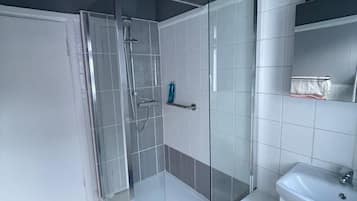 Eco-friendly toiletries, hair dryer, towels, toilet paper