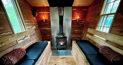 Quiet bungalow in west Asheville with hot tub, fitness room, and a wood stove.