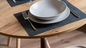 A dining table with plates, cutlery, and glasses set for two. - Lo Studio di Angelique - Florence Dolce Vita (Florence)