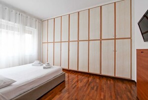 1 bedroom, desk, iron/ironing board, travel crib