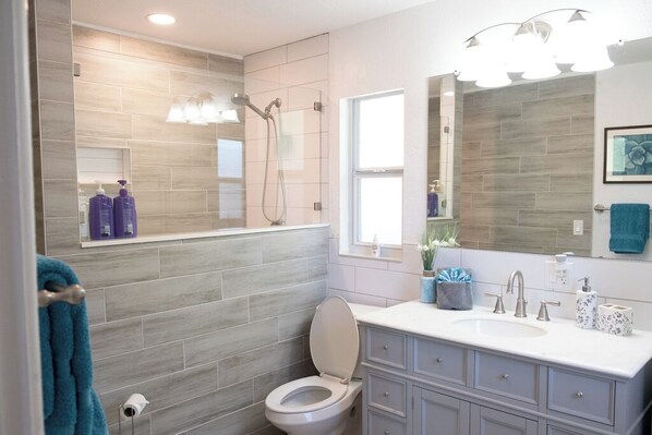 Shower, hair dryer, towels, soap