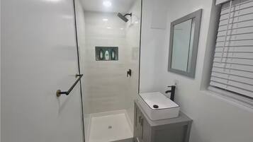 Shower, towels, soap, toilet paper