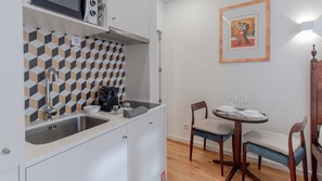 Fridge, microwave, stovetop, coffee/tea maker