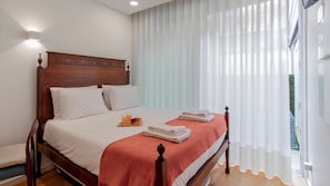 Sunlight streams through elegant sheer curtains, illuminating the comfortable bed and creating a serene atmosphere.
#Bedroom #NaturalLight #LovelyStay