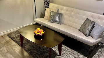 Standard Suite | Living area | 42-inch LED TV with cable channels, books, offices