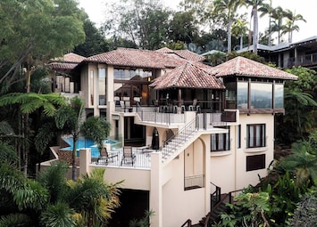 This award-winning three-level villa offers secure parking for two vehicles for a hassle-free arrival and departure, all set amidst lush tropical surroundings.