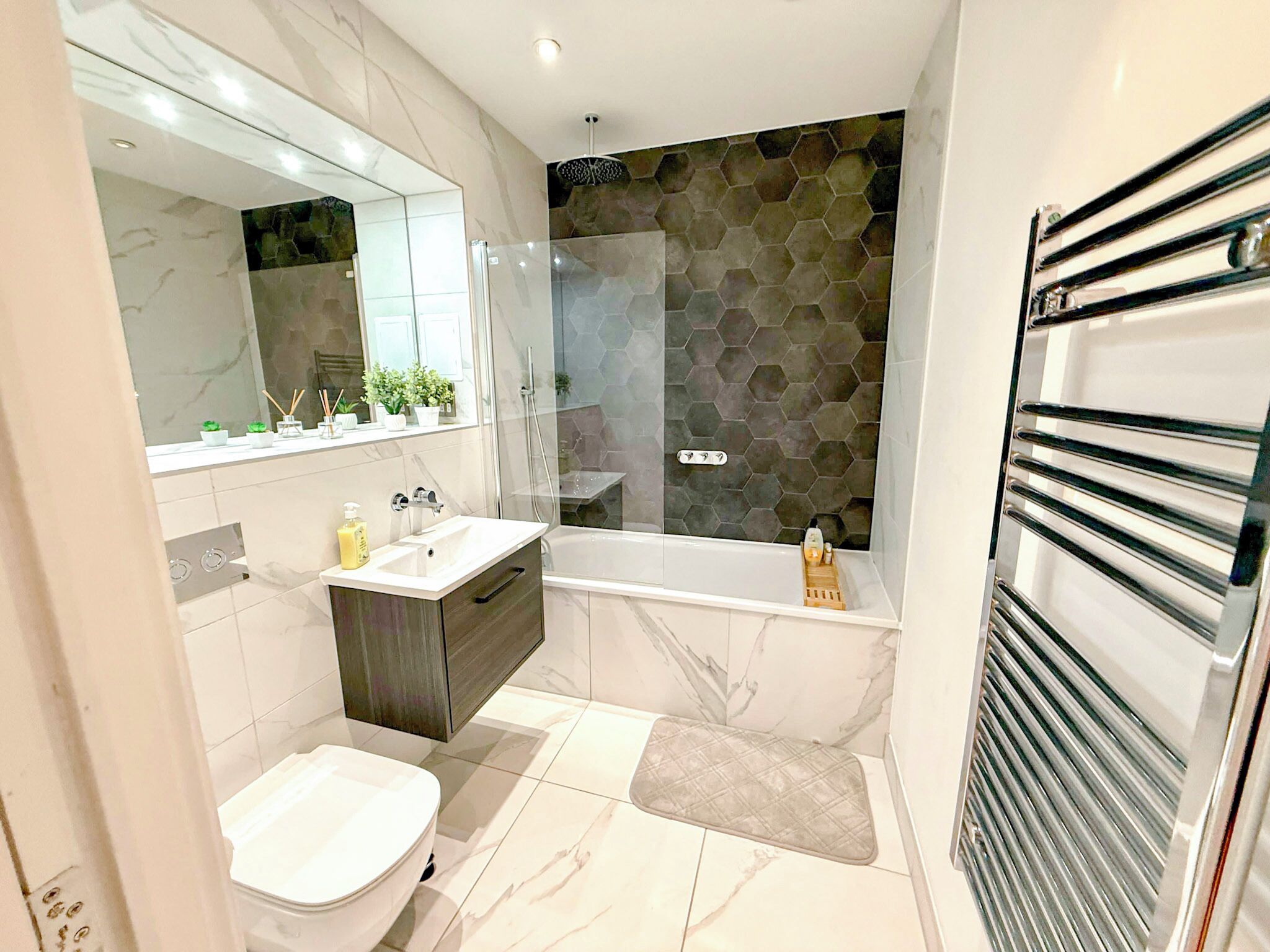 Shower, hair dryer, towels, soap