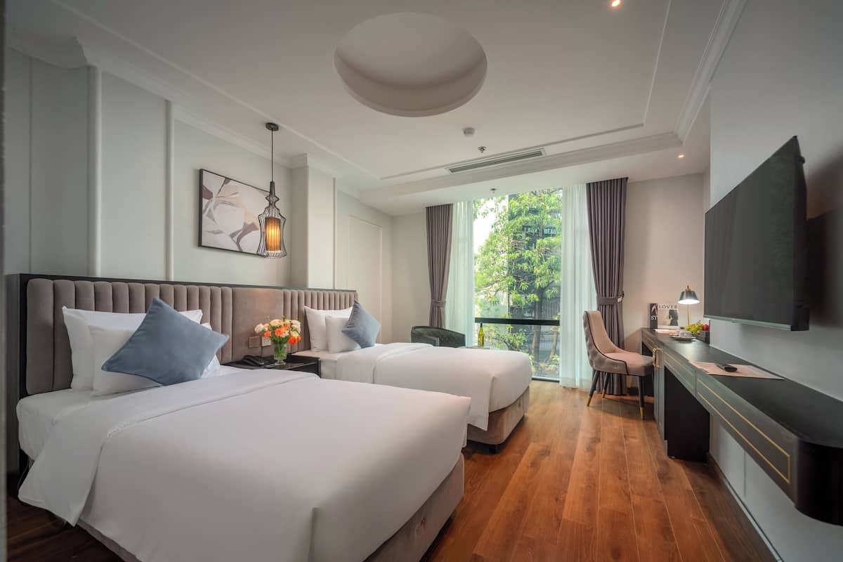 Habitación ejecutiva con 2 camas individuales | Ropa de cama de alta calidad y minibar