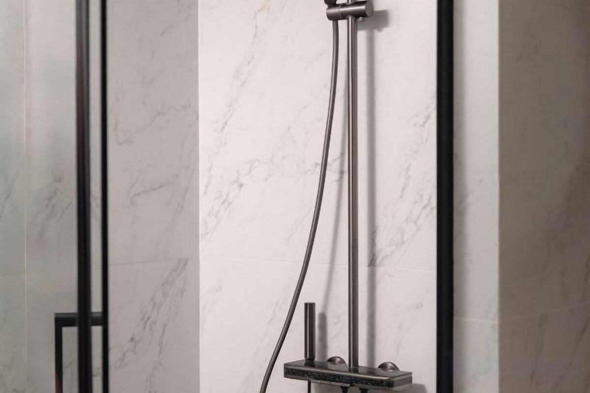 Deep soaking tub, hydromassage showerhead, designer toiletries