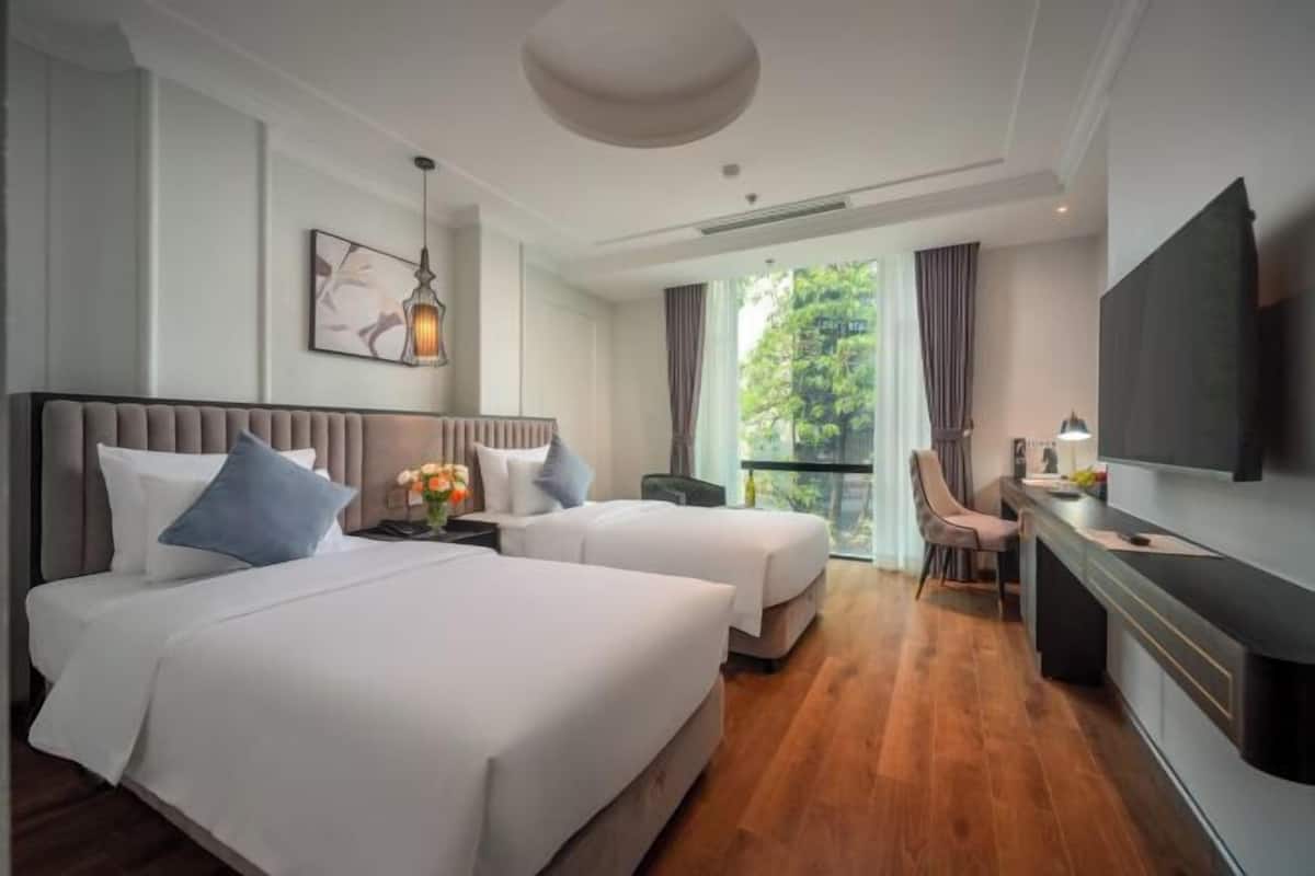 Luxe beddengoed, een minibar, een kluis op de kamer, een bureau