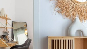 A modern office space with a desk, chair, and a large mirror. - A (VA078-3) TH Bioparc Apartment C (Valencia / València)