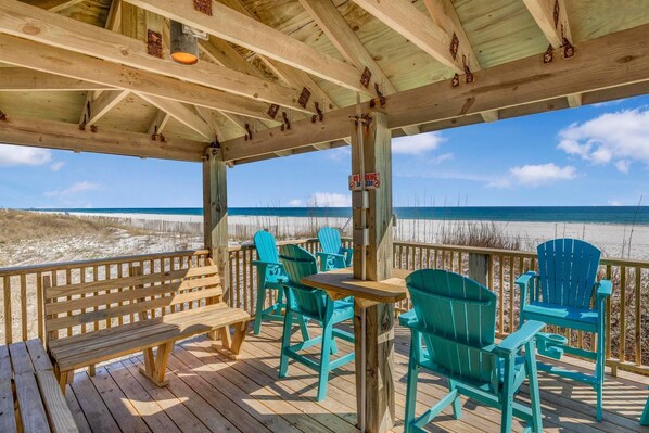 Enjoy the ocean views from this expansive deck with comfortable seating and a clear view of the beach.