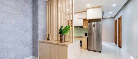 Apartment, City View | Living area | 55-inch LED TV with cable channels