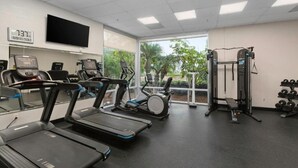 A gym with treadmills, stationary bikes, and weight machines. - 2 Bedroom 2 Bath Condo in Oceanside Within Walking Distance to Ocean and Dining (Oceanside)