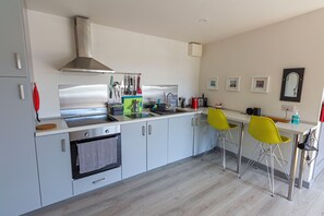 Microwave, oven, stovetop - Attractive light-filled detached apartment near the sea in an East Cork village. (Cork)