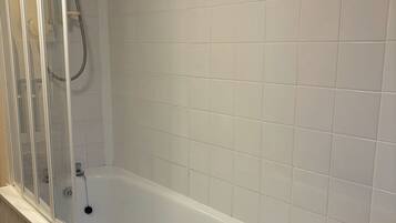 Apartment | Bathroom | Separate bathtub and shower, deep-soaking bathtub, towels